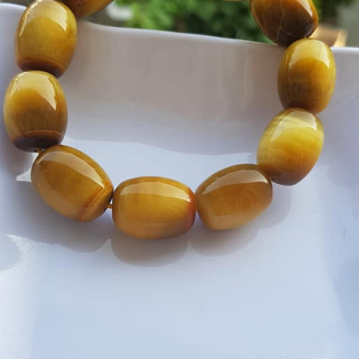 Vòng Tay Phong Thủy Nam Mệnh Thổ Kim Thủy Mới Đẹp Hạt Lu Thống Mới Vàng Nâu bóng đẹp Chất liệu đá mắt hổ tự nhiên vàng nâu bóng đẹp ạ Size hạt 14mm x dài 19mm ạ