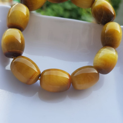 Vòng Tay Phong Thủy Nam Mệnh Thổ Kim Thủy Mới Đẹp Hạt Lu Thống Mới Vàng Nâu bóng đẹp Chất liệu đá mắt hổ tự nhiên vàng nâu bóng đẹp ạ Size hạt 14mm x dài 19mm ạ