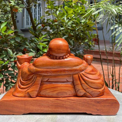 Tượng phật di lặc tay nâng thỏi vàng bằng gỗ hương đá kt ngang mặt 60cm