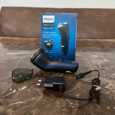 Máy cạo râu khô và ướt Philips AquaTouch S1121 Serial 1000 với lưỡi cạo ComfortCut tự mài - HÀNG NHẬP KHẨU