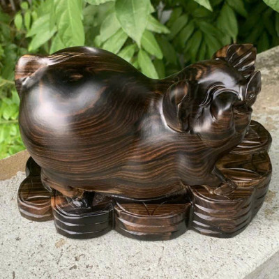 Tượng con heo ( lợn ) phong thủy cầu tài lộc bằng gỗ mun hoa kt 20cm 