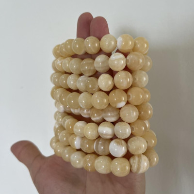 Vòng tay chuỗi hạt ngọc thật màu vàng cam cho người mệnh Thổ và hỏa đường kính hột 10 li (1cm)