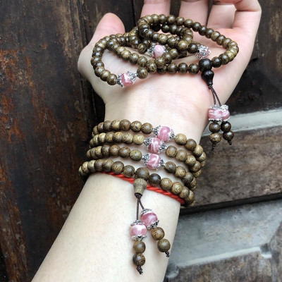 Vòng Tay Trầm Hương phối Đá Đào Hoa cùng charm bạc thái - bình an, may mắn, tài lộc